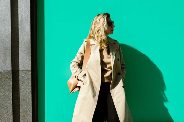 How can you style a trench coat for a casual look?